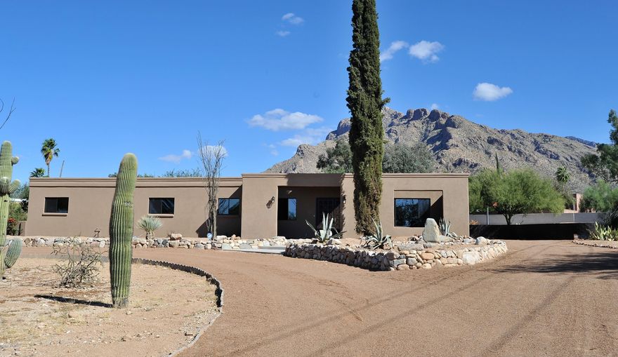 A Rare Find! Gorgeous remodeled home on nearly 1 acre with a Pool, Mnt views, 4car garage, no HOA.  attached guest house w/1BR, fam rm, bathrm, it’s own 2car gar & sep yard! Room for an RV & covered parking for your boat! Great curb appeal & 2 circular driveways. 2 family rooms, huge kitchen w/granite counters, stainless steel appliances including range hood, gas stove, microwave & dishwasher, pendant lights over bar seating plus lg dining area. Kit opens to the family rm w/double French doors, recessed lighting & gorgeous wood floors. Decorative fans & mirrors throughout, freshly painted & new dual pane energy efficient windows. Exterior has new stucco for an updated look! Incredible backyard! Covered patio, extended brick pavers, covered Ramada, large sparkling pool & huge side yard!