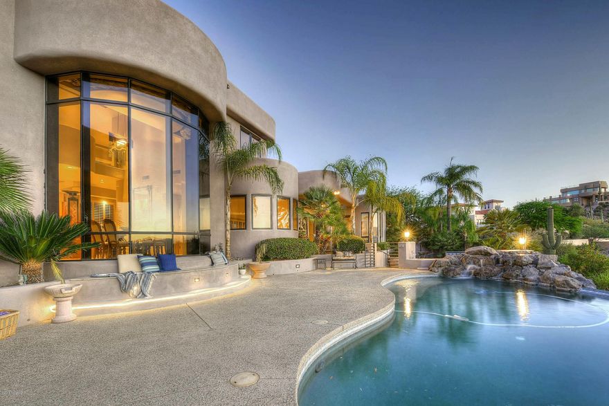 Range listing...sellers will accept or counter offers within the range of $825,000 and $885,000.HUGE Price reduction of over $150,000! High on a hill this stunning contemporary affords unmatched city & mountain views! Enter through a dramatic portico w/custom doors and soaring ceilings greet you w/ views from every room. Custom built, this one owner home offers large master suite & office on the main floor & 3 generous guest suites on the upper level.The home is adorned in neutral colors, custom plumbing and lighting fixtures.Don't miss the stunning formal dining room! Open concept kitchen/nook great way to stay connected to your guests.Family room opens to gorgeous back yard with endless city views! Lower level has private guest suite w/bathroom & separate entrance to rear yard.