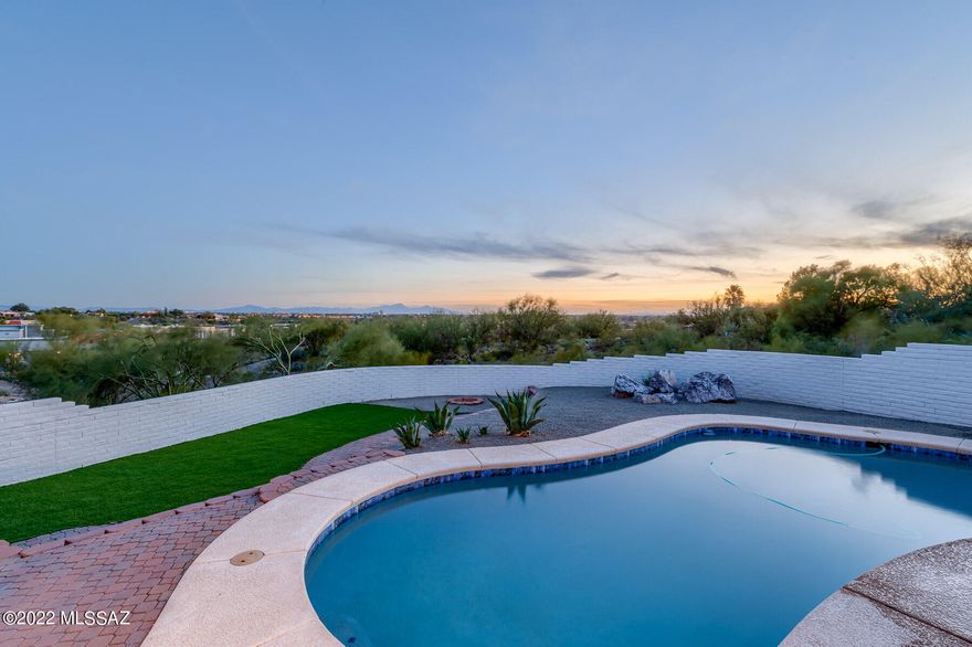 Captivating city and mountain views!!! Let the natural world surround you in this beautifully remodeled home that features four bedrooms, den and a tranquil atrium. Step through the inviting double doors to see all this home holds for you, including: new tile flooring, paint, fixtures and ceiling fans throughout. Kitchen features new plywood boxed cabinetry and hardware with quartz counters, a large waterfall peninsula with modern pendant lighting. New appliances and fixtures. Beautiful fireplace in the great room to cozy up in front of on the winter evenings. Don't miss the bathrooms which have been updated with new dual vanities and stylish design choices. Outside is an extended patio perfect for large gatherings or pool parties with your easy care and turf landscaped yard. Enjoying your pool will be relaxing with your brand new pool equipment and Pebble Tec plaster! Agent/Owner
