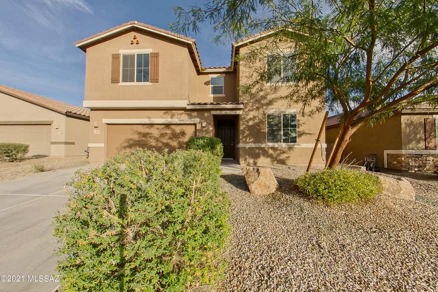 Spacious 4/2.5 on Tucson's north west side. This home is open and airy with a dream kitchen. Tons of cabinets and huge island. Countertops are granite with stainless steel appliances and modern lighting throughout. The kitchen also features a very large pantry tucked away with a large coat closet at the garage entrance. One bedroom downstairs and three bedrooms upstairs and a loft! All new carpet. All bedrooms upstairs have ceiling fans and walk in closets. Large laundry room is upstairs for convenience. Come check this beautiful home in a nice, quiet neighborhood with mature vegetation. Tons of schools, shopping and restaurants nearby.