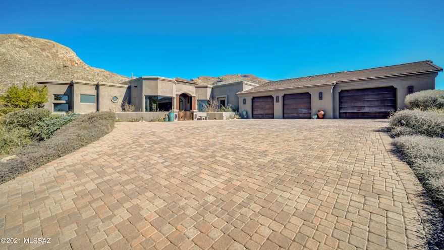 Exclusive Pima Canyon Estates home in the upper-gated area of Sunset Gardens. This perfectly situated, corner lot home has unsurpassed views of Pima Canyon!  Inside, the expansive great room leads to a remodeled gourmet kitchen with Cambria countertops, SS appliances and a huge island. The master bedroom suite showcases a fireplace with integral color lime plaster and a large, walk-in closet with an array of built-ins. The master bath has been completely updated with a steam shower & freestanding soaking tub. In addition to 3 other spacious bedrooms, there is a bonus room that can be used as an office, library, yoga studio, hobby room, teen hangout or whatever. Both  AC units are new in 2019, and there are no steps in this home. The main patio has a cozy fireplace and overlooks the pool & spa while the second covered patio has entrances from two bedrooms. The 4-car tandem garage also has a separate workshop with upgraded electric, a sink and exterior entrance. Residents have their own private access to hiking trails in Pima Canyon.