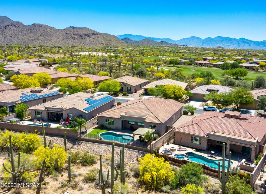 Gorgeous remodel in immaculate condition. Pool, hottub, gazebo outdoor relaxing 'room' - a most entertaining yet peaceful outdoor living environment. Sellers have highly upgraded this truly move-in-ready home including a roughly $75K kitchen remodel w/new cabinets, Cambria Quartz countertops, backsplash, composite granite sink, touch free faucet, draw pulls, soft-close hinges, rolling drawers, 36'' gas cooktop, custom vented shiplap hood/insert, under cabinet lighting. Additional upgrades include new outdoor hot-tub, epoxy garage floor, new lights & fans, shiplap walls in great room & formal dining area, custom floating shelves in great room, new stunning barn door in primary bedroom, full house interior paint including ceilings, doors, closet shelving & baseboards.  Added garage shelving, snake fencing for yard, a Ring door bell that will convey, drainage rock landscaping. All kitchen & laundry appliances may convey. The outdoor living is peaceful, relaxing yet entertaining. Artificial turf area, gazebo/ramada living room w/adjacent hot tub, spacious under porch viewing of natural desert, mountains and mesmerizing sunsets.  Garage has upper storage - and the tandem garage is clean and spacious.  The home is in extremely excellent condition and a quick move-in is available if desired.  Enjoy gated subdivision living with neighborhood sidewalks, beautiful surroundings, community parks near by, Ritz Carlton right down the street. Home is nestled within the community of Dove Mountain - home to 3 outstanding golf courses, and a highly desired, wonderful C-Stem K-8 school. Dove Mountain is home to a plethora of nature & hiking trails (most registered on the Town of Marana website), w/natural desert flora & fauna abounding.  Dove Mountain is also a dark-sky community so everyone can enjoy the nighttime skies full of stars.  Feel free to call for a private showing.