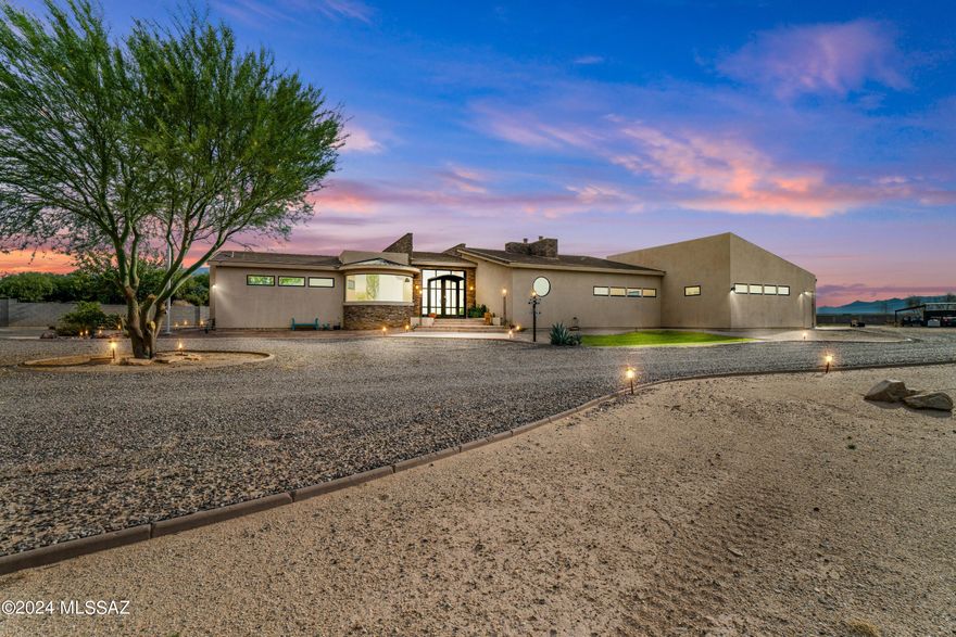 Wow! You will not believe the features and individuality of this Ultimate Contemporary style home. The entry has unique custom forged doors with windows from floor to ceiling. The kitchen boasts of a huge granite/stone galley style kitchen that is big enough for entertaining large gatherings. The family room is connected to the main gathering area, but can be closed off with Eastern style frosted doors that slide from the floor to the ceiling. The windows up above have a remote window blind system which make closing the windows a breeze. Enjoy the dual gas fireplaces that add warm ambience to the entire entertainment center. -- The Master Suite should be called the Master Retreat as it has ambient lighting and a raised garden tub perfect for soaking and relaxing after work. You can also enjoy the fenced outdoor jacuzzi with colored lighting for fun. -- For your business needs, the front office is spectacular. The rounded windows and desk are a showcase worthy of any hard worker. All of the cabinets in the house are made of solid cherry wood. Schedule your appointment today!