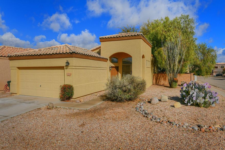 Wonderfully maintained, freshly painted inside and out, home on large corner lot.  Tile and wood flooring throughout.  Tile counters and backsplash in kitchen. Separate garden tub and shower in the master bath. light, open floor plan.  Large backyard with full length covered patio.