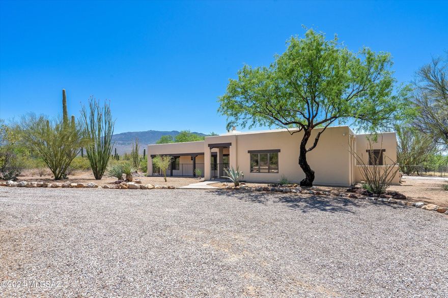 Welcome home to VIEWS! Soaring ceilings in great room showcase Rincon Mountains. Open floor plan with views from most windows. Full covered patios front and back. New roof, new interior paint, new carpet. Oversized insulated garage has corner shelving-workspace with more mountain views from window. Desirable Cebadilla features large lots, a private community lake and walking trails.