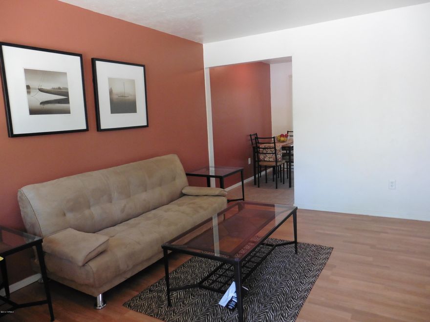 Fabulous END UNIT- Move-In Ready or Turn-Key Rental in gated community. This Unit features: A Security System, Private Closed-In Patio, Walk-In Closet, Decorative Light Fixtures, Laundry Room with Washer/Dryer included, & Built-In Microwave. Enjoy all the amenities at the Recreation Center:Swimming, Playground, Grilling and more!!  Walking distance to Public Transit and Shopping Centers.
Just minutes away from the UOA and Pima Community College West Campus!