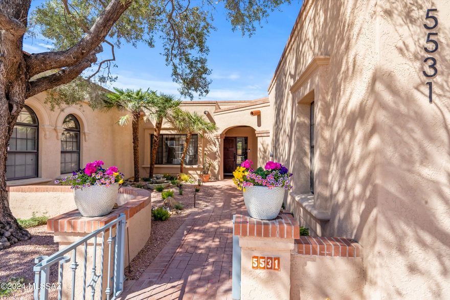Pristine move in ready townhouse in desirable gated San Miguel Community. A paver courtyard entry leads to the inviting gated front porch. Beautiful living room with beamed ceilings & cozy fireplace. Over $175K in updates throughout the home. Spacious primary suite with updated en-suite bath.Expansive  backyard   where you can enjoy the Tucson outdoor living lifestyle.  Close to shopping, dining, art galleries, bike trails & The Loop!  TMC and Whole Foods market and access to the Huckleberry Loop are less than a mile away.  Rentals have a 6 month minimum. HOA fee includes gated entry, roads, common area maintenance including tree trimming and front yard maintenance, trash, clubhouse with kitchen, pool, spa and tennis courts.