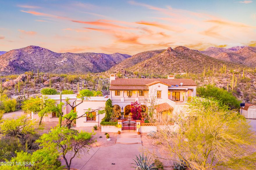 Exquisite, privately gated Santa Barbara style estate w/ UNOBSTRUCTED mountain views located on 5.77 acres of pristine, saguaro-studded land in the lush & tranquil Tanque Verde Valley. Live in complete privacy & seclusion on a  cul de sac at the base of the Agua Caliente Foothills. Enter through a spacious courtyard w/  a beautiful fountain into this 5 bed/ 4 ba, Rastra block home.  Dramatic 23 ft beamed ceilings in great room are complimented by a wall of enormous windows to capture the unobstructed mountain views. Formal dining room, cozy family room w/ FP & gourmet kitchen w/butcher block center island. Gracious en-suite bedrooms downstairs.  Upstairs master suite w/ FP., huge master bath, loft/library area, separate office and balcony w/ gorgeous views of the city & mountains-Mo Backyard w/magnificent views, large turf area, pool and spa. Built-in BBQ and plenty of dynamic outdoor spaces to enjoy the views from this special property.  4-car garage. Current owners added an 802 sf  heated and cooled bonus/hobby/workshop where 2 of the 4 car garages are located. Roof-top deck to capture city lights.Top rated Tanque Verde Schools within close range.  49ers Country Club within 5 minutes for Golf, Swimming, Restaurant and Brand New Fitness Center. La Mariposa Tennis and Fitness Club also nearby. Incredible hiking and biking in every direction.  Saguaro National Park East, Mount Lemmon and Redington Pass are just a few of the incredible places to enjoy the outdoors. Tanque Verde Guest Ranch within minutes.