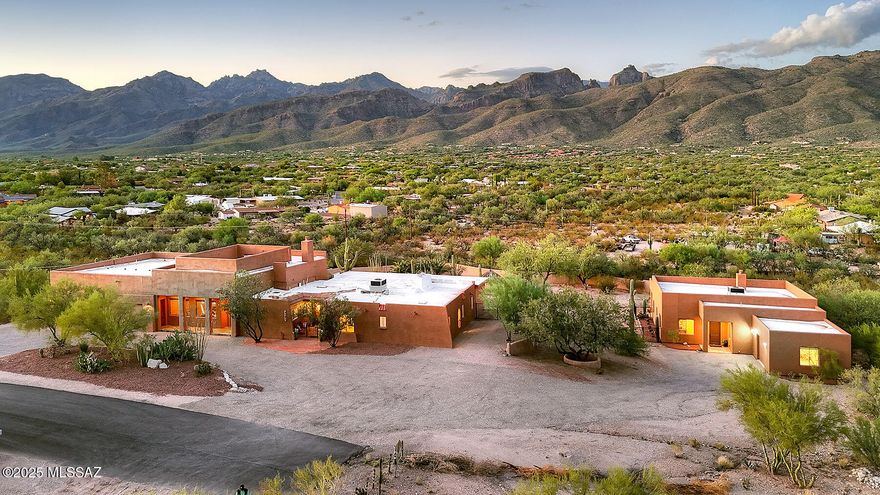 Enjoy resort-style living with Spectacular Mountain Views on this 3.56-acre horse property with No HOA. A 4,175 sq. ft. main home &1864 sq. ft. Guest House feature: 4 bedrooms, 3.5 baths in Main House w/travertine tile, a great room with fireplace, remodeled kitchen, gym & an expansive 25'x30' primary suite w/sitting area, wet bar, custom closets & spa-like bathroom. A secondary suite offers its own fireplace & remodeled bath. Outdoors, relax by the custom diving pool w/palapa, terraced landscaping & walled yard. The 1,864 sq. ft. guest house includes 2 baths, a full kitchen, living & family room, a primary suite w/jacuzzi, &  fenced yard w/covered patio. Updates include 3 new HVACs, water heater, & fresh paint. A 3.5-car garage w/custom cabinets & 1 car garage on Guest House. A rare find