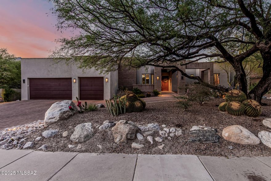 Discover refined desert living in this remodeled 3,891 sq. ft. estate in Tucson's gated Ventana Canyon. On a .7-acre lot with a wrap-around yard, this 4-bedroom, 4.5-bath home backs the 7th fairway, with Catalina Mountain views. Renovated in 2009, the great room features soaring ceilings and large windows. The gourmet kitchen has top-tier appliances, a large concrete island, and granite countertops. The primary suite includes a fireplace, spa-like ensuite, his-and-hers closets with built-in shelving, and patio access. Enjoy a media room, office, and guest quarters with private entrance and patio. The backyard offers a covered patio, BBQ, gas fire pit, and desert landscaping. Ventana Canyon Country Club provides two golf courses, pools, tennis, fitness center, spa, and dining. Near downtown Tucson and Sabino Canyon. Tour today!
