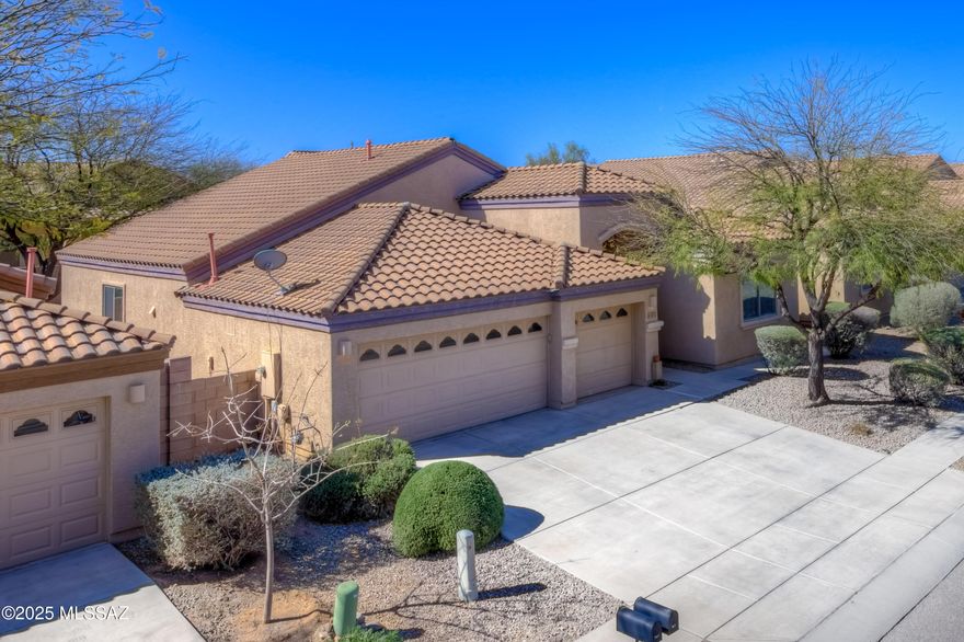 Discover the perfect blend of space, style, and functionality in this stunning 4-bedroom + den, 2-bathroom home, boasting over 2,300 sq. ft. of thoughtfully designed living space. Freshly painted in a neutral palette with brand-new carpet in the bedrooms, this home features a split floor plan, soaring ceilings and both ceramic tile and plank flooring in living areas for durability and elegance. Each bedroom is equipped with ceiling fans and double-hung closets for added comfort. The chef's kitchen is a standout, offering beautiful wood cabinetry, stainless steel appliances, gas cooking, granite countertops, an island with breakfast bar and a pantry, all with sightlines to the den and great room. A separate laundry room adds convenience, while the extra-deep 3-car garage provides ample ample space for vehicles and storage. The primary suite offers direct rear yard access and a spa-like en-suite with a soaking tub, executive-height dual sinks, a walk-in shower, private commode room, and an impressively spacious walk-in closet. The hall bath is equally well-appointed with dual sinks and a tub/shower combo. Step outside to enjoy the covered patio and paver-lined backyard, perfect for outdoor relaxation.  Conveniently located, this home is move-in ready and waiting for you!