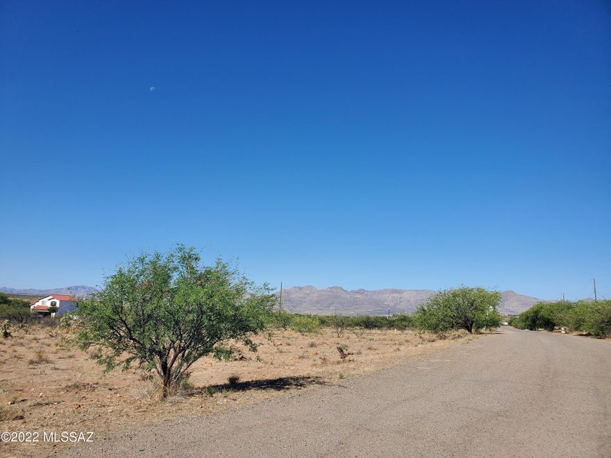 Big beautiful flat lot ready to build your dream home.  Water, electric and sewer available; however should be verified during inspections. Gorgeous views.  Paved road.  Close to the schools, shops and the interstate.