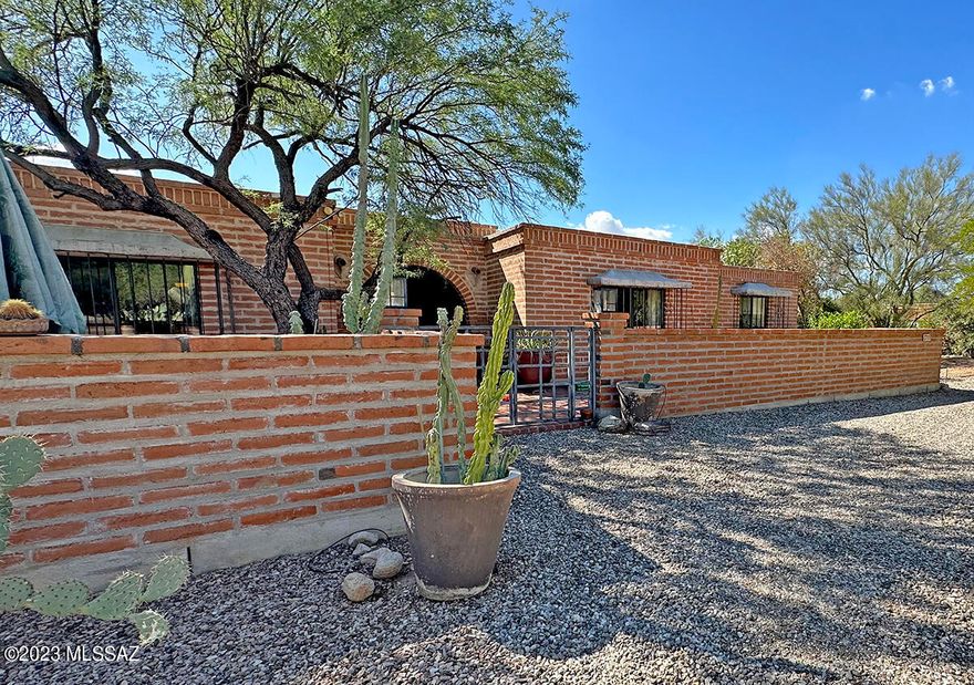 Beautiful Territorial Home in highly desirable Casas Adobes! Attention to detail shows the love and rich artistic aesthetic the owners have for this home. Two Car Garage.Enjoy a dinner with friends in the elegant brick courtyard with fountain or the lovely dining room off of the living room. Maybe take a swim in the early afternoon to cool off in the summer months. If you have a home business, make sure to check out the spacious, separate studio in the back. Lots of outdoor space 3 fenced garden area or Tortoise Habitat, 2 sheds. This 3 BR/3BA home sits on .98 acres and can be yours cherish and make many happy memories for years to come.