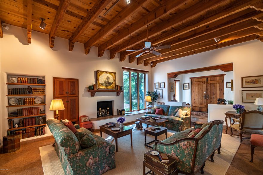 One of a kind home on the golf course in the Tucson Country club.

This home is a mud adobe with 24'' think walls, high ceilings with charming wood beams and lots of character. The attention to detail is exquisite, the views and the privacy of the lot is amazing! The main house is 3 beds, 2 bathrooms, great room, dinning room, eat in kitchen and just off the kitchen a nook area and screened patio room. Detached garage with heated and cooled workshop, storage room and a guest house with 2 queen Murphy beds, bathroom and a kitchenette. Mesquite trees surrounding the property and utility lines buried so not to obstruct the views.