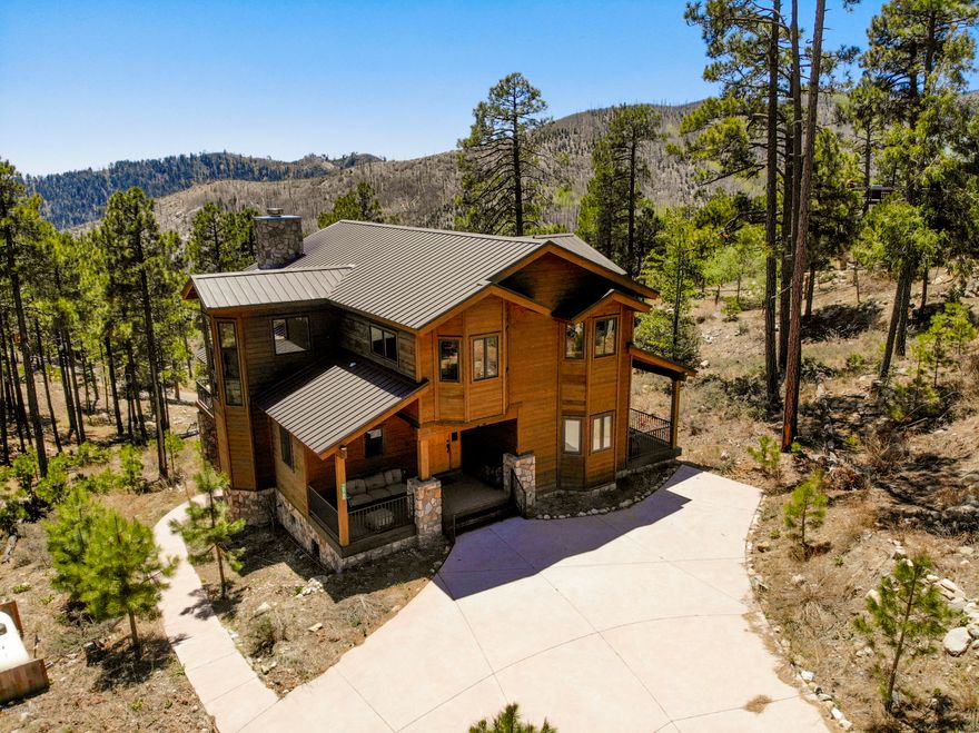 Great family cabin on 16k sq ft lot. Concrete asphalt driveway with plenty of space for plenty of cars. Beautiful open floor plan with a fully equipped kitchen, double oven, stainless steel appliances and granite counters. Wood floors throught out the cabin.Laundry room with plenty of storage. Master bedroom off the main floor with its own private deck.Living room opens to a large Trex deck.  Both bathrooms have slate counters. Upstairs one bedroom  and a large open loft with a open bar area. Loft looks out into the full grown Ponderosas. Cabin sits on 16k sq ft in the desirable Loma Sabino pines HOA with year around access.   The bottom of the cabin has a partially finished basement, great for storage of tools or could be finished for a great rec room. This a beautiful CABIN in the woods