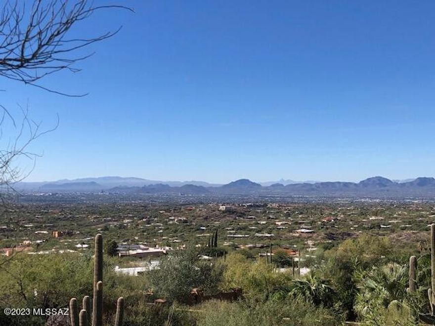 Unobstructed views OVERLOOKING ALL of TUCSON and SURROUNDING MTN RANGES. You'll never tire of these AMAZING VISTAS. Intimate, 11 lot, 9 house gated neighborhood at the north end of Swan Road borders the NATIONAL FOREST and is comprised of some of Tucson's FINEST CUSTOM HOMES. The North/South oriented lot lends itself to a multi-level or two story design with plenty of room for a substantial plan, See Documents for a list of HOA variances given to this site, easing the bldg process. You'll enjoy excellent and quick access to all FOOTHILL'S amenities as well as central Tucson's cultural resources. Only currently available site in this UNIQUE SUBDIVISION, THE SUMMIT. There are no comparable view lots in the foothills at this price!