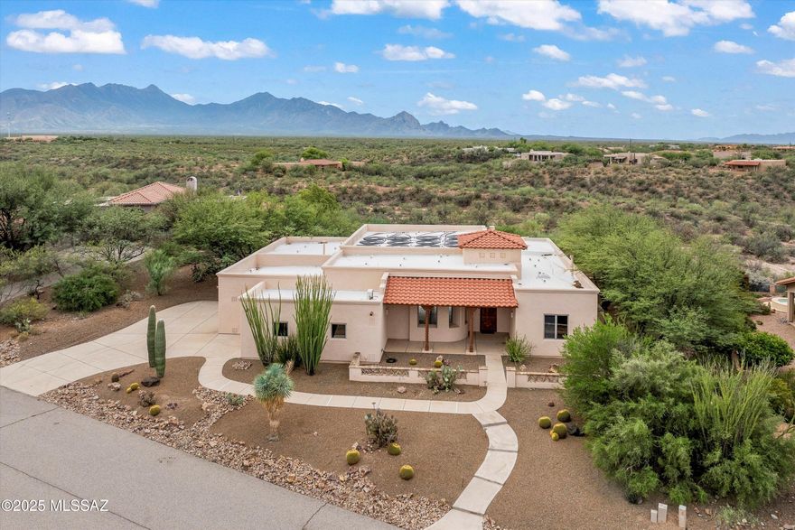 Stunning 3-bedroom + den home w magnificent panoramic mountain views. This home has thoughtful upgrades throughout. The spacious floor plan features a beam-accented ceiling, fireplace, and neutral tile, interior was painted in Jan 2026, alder doors and abundant storage. The chef's kitchen is complete with electric oven, gas cooktop, slide-out cabinetry, and reverse osmosis. All bedrooms offer a walk-in closets. Outdoors, enjoy true resort-style living with a lap pool, built-in BBQ, and large covered patio. The 3rd-car garage can be used as studio or workshop with its own mini-split for year-round comfort. All 3 garage bays are extended in length and width. This home is perfect for those seeking both luxury, versatility with breathtaking views as the backdrop.