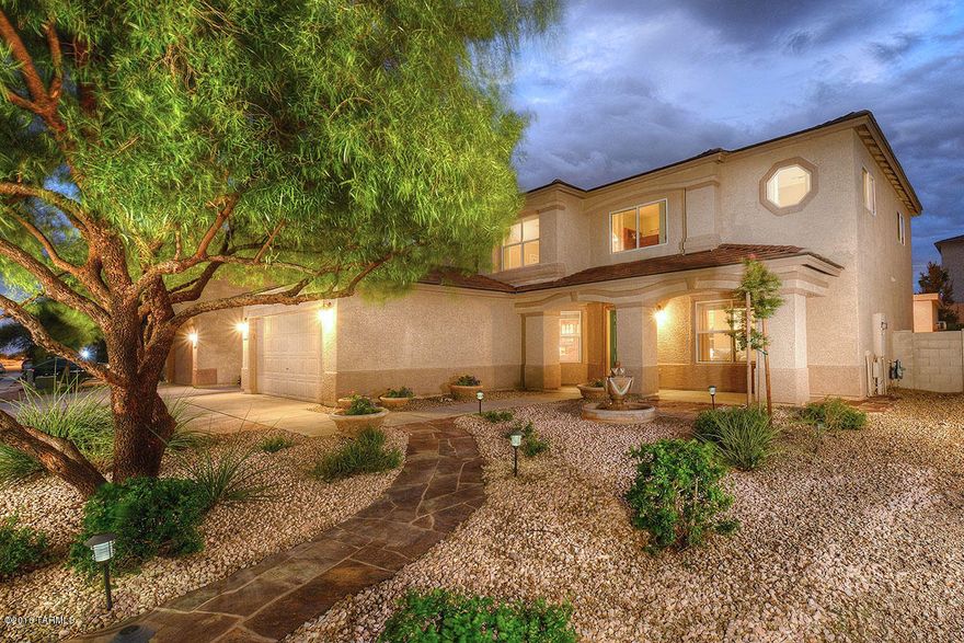 Professionally landscaped front yard w eye catching curb appeal! Enjoy your evenings sitting on the front porch watching the world go by as you enjoy your mature garden. This 5bd,3ba home has plenty of room.The kitchen opens to the family room for easy entertaining. The dining room is spacious w plenty of seating for large parties. There is an upstairs loft for kids to hang out or a home office. One bedroom is located downstairs,convenient for guests. The home has a soft,relaxing color palette. A permitted bonus workshop out back has AC! The backyard has a large covered patio for having a BBQ w family and friends.The kids will love the BB court. Award winning Vail Schools. Easy commute to Raytheon and DMAFB This home is ready for a new family. Welcome home!