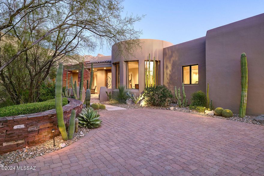 Stunning Southwestern contemporary in gated, prestigious The Canyons, by quality builder RB Construction.  Outstanding architecture, construction, art sense and attention to detail describe this 4-bedroom (den with closet and built-in bookshelves could be 4th bedroom), 3 ½-bath, 4,154 sq. ft. and oversized 1,069 sq. ft. 3-car garage home.   Access property over paver driveway with stacked-stone retaining walls, to front entry with flagstone floor, artist-made copper and glass entry door, into foyer and living room with flagstone floors, soaring cross-beamed ceiling with walls of windows, stacked-stone fireplace and 8' alder doors throughout.  Gourmet kitchen features granite counters, center island with prep sink, stainless steel appliances including 6-burner Viking professional gas range and Sub-Zero fridge, walk-in pantry, and breakfast nook.  Formal dining room has walls of windows and wine cooler.  Gracious primary suite offers stacked-stone fireplace, dual sinks, spa tub, walk-in closet, Turkish travertine tile in bath, European plumbing fixtures and Italian custom mirrors.  Professionally landscaped backyard has oversized porch with stacked-stone columns, flagstone flooring, pool/spa with waterfall, built-in BBQ, and so much more.  See to appreciate!