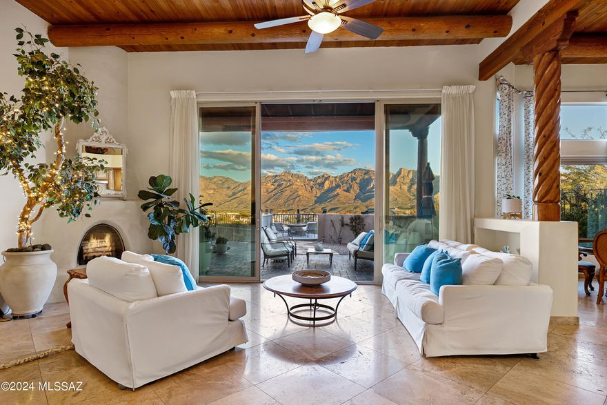So ,you are looking  for a home with a VIEW ?  Look no further .This view is everything you can imagine and more !  Full Panoramic range of the Catalina Mountains out your back door. 
This stunning  custom Sante Fe style home which lies within the small gated community of Vistoso Pointe, conveniently located in the Town of Oro Valley . This location is close to shopping , hospitals ,the renowned bike path The Loop  & hiking trails of Catalina State park .
4 bedrooms & office situated off the primary , 3.5 baths ,offering both casual & formal dining . You will be absolutely stunned at the beautiful mountain view as you enter the home.
The  second feature to grab your attention  is the 15 ft ceilings that are flanked with Vega beams &  planked with tongue & groove artistry . The home also offers both formal living area & casual family room , there are multiple areas for gathering & entertaining in which you will use your beautifully designed  kitchen for all your cooking & hosting needs.
Once outdoors you are greeted by a viewing deck or follow the inset lighted path to your pool & spa .
The home offers leased solar , and there is even a stucco and frame dog house off the covered patio!