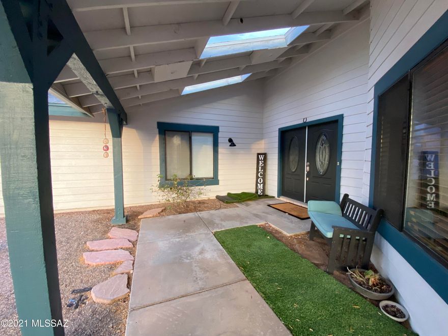 This is it a 7 bedroom single story home with a 2 bedroom single story guest house in the Tanque Verde School District. The main house features two master suites, vaulted ceiling throughout, wood looking tile throughout, new ceiling fans & wood laminate in rooms. Split floor plan- 5 bd on one side & 2bd on opposite side (gym & office) The kitchen boasts an abundance of cabinets, island w/ gas cook top, plus 2 breakfast bars for plenty of seating. Walk outside to a large walled yard, w/ covered patio & turf grass plus sparkling pool & spa. The separate (unattached) guest house features full kitchen & dining room w/ views to the Catalina mountains 2 bd/1ba plus interior laundry area, covered front patio, separate entrance & separate walled backyard. North/South orientation all located on over an acre on beautiful Windridge Loop.  This home is perfect for multi-generational living, care home, Air BNB or just some spread out peace & quiet! All bedrooms have closets but the simple floorplans makes for easy changes if you prefer to make 2 bedrooms into 1 large room. The possibilities are endless- Library, Gym, man cave/woman cave, Office, art studio, etc. Plenty of parking, over sized garage & extra storage shed.