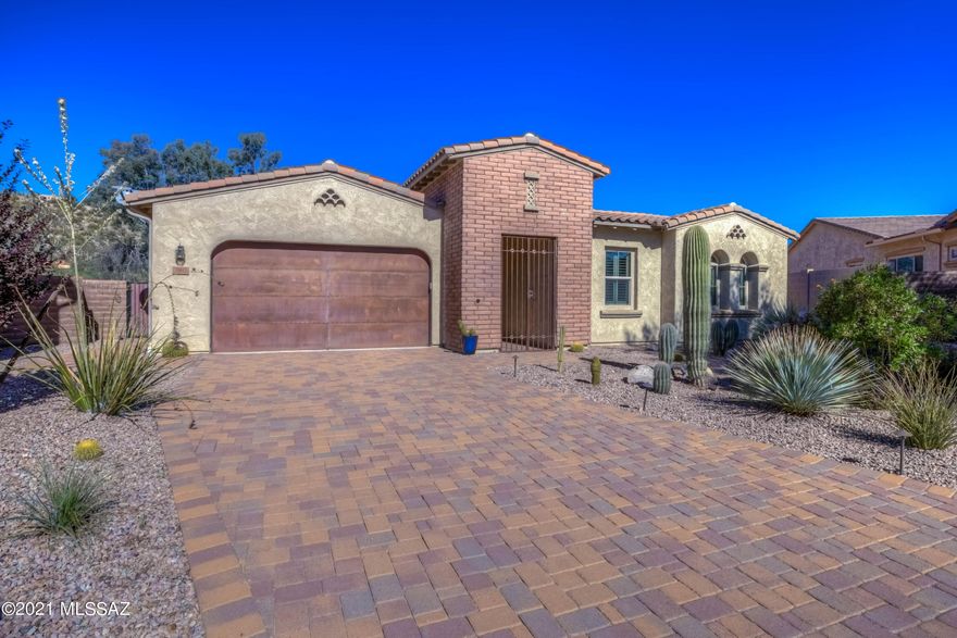 Welcome to this STUNNING home in the beautiful Deseo at Sabino Canyon gated neighborhood!  Featuring 3,132 sq.ft., 4 beds PLUS Den/Office with built-ins, 3 full baths and a Great Room PLUS an extra Family Room, this gorgeous home is sure to exceed your expectations!  The open Kitchen features an island, 5-burner gas cooktop, gourmet vent hood, double ovens, custom backsplash, designer cabinets and a bright breakfast nook!  The spacious Primary Bedroom boasts of a luxurious en-suite bath with soaking tub, walk-in shower, large linen and walk-in closet! The Guest wing features 2 bedrooms, a full bath w/dual vanity and it's own Family Room!  Venture outside to a HUGE rear yard w/covered patio/electric sun shade, pavers, fruit trees & BBall Court! Mountain Views from every Room! Click More... Additional Features include: Leased Solar, whole-house alarm, tandem 3-car garage with storage racks, closet, finished floor and both an indoor and outdoor Tesla charger, interior closet built-ins, ceiling fans, rain gutters and much more!