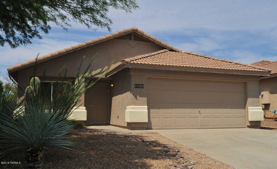 Spacious, 3br/2ba open floor plan with many nice upgrades in Rancho Vistoso. New granite counter tops in kitchen, gorgeous tile floor with custom inlays, new carpeting, custom paint, updated lighting fixtures. Huge rear yard with extended flagstone patio and built in BBQ. 2-10 Home Warranty included & termite treatment just completed with one year warranty. Very nice home!