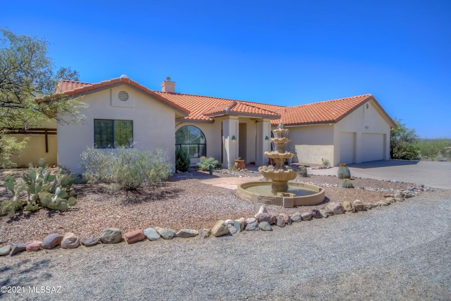 Amazing equestrian custom home on over 4 acres in prestigious La Cebadilla Estates with panoramic Rincon Mountain views & direct access to TV Wash & Saguaro National Park riding trails. Chef's gourmet open kitchen (gas), oversized master suite, concrete floors, large 3 car garage, open/split floor plan. Exceptional property is peaceful, private & versatile. Outdoor entertaining – expansive flagstone patio, sparking pool/spa. New roof underlayment with warranty, owned solar with warranty, new concrete overlay floor throughout & master closet (2021). Newer pool pump/heater (2019). Horse property w/ multiple stalls, tack room, hay barn, arena & dog runs. Community catch/release lake. Tucson's best riding, cycling, hiking & bird-watching! Tanque Verde School District