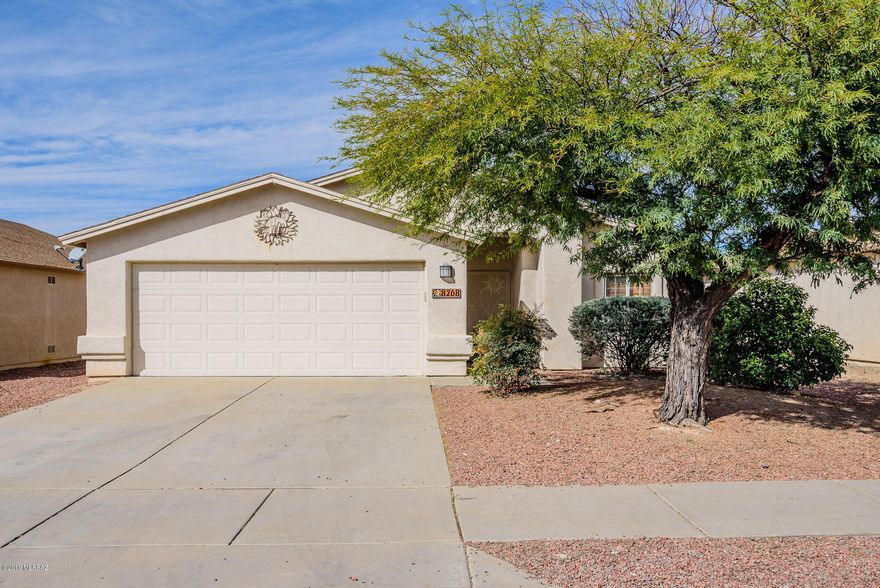 Turn key 3 bedroom home with beautiful ceramic tile throughout. Lots of decorator touches and extras: recessed lighting, oak molding, dual vanities in master, gas stove, built in microwave, pullout shelves, two remote fans, garden tub and custom wood blinds. Nice size elevated lot with covered patio, paver walkway & irrigation system. Make an offer today!