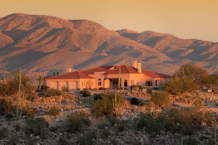 High on a hill in the Catalina Fthls w/unprecedented 360 degree city & mtn views. Cul-de-sac lot designed by Ron Robinette, interiors by Lori Carroll. 4 bdrm or 3 dbrms + den. LR w/dramatic 20' ceilings & outstanding architectural design, travertine flrs, gourmet kitchen w/granite counters & views. Views from all rms, 3 FP's, gracious mstr ste w/fireplace flrs. 3 car garage w/workshop & extra high garage doors. Stunning rear yard w/''see forever views'', pool/spa BBQ w/refridgerator & wrap around porch. See all fireworks in town on the Fourth of July.