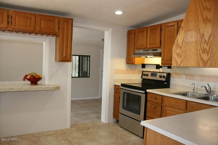 Rare find! A 4 bedroom 3 full bath home in Central Tucson on a .19 ac lot. Shady parking, large laundry room, block wall, carport, AC, citrus trees, security bars. Work recently completed: Rheem AC/heater, 90% of duct work replaced, carpet & tile, interior paint, canned lighting in most rooms, barn door installed in master bedroom, Toilets, 2 sinks and faucets replaced, stainless steel oven/stove/hood & dishwasher, LED remote fan/light in master, fresh baseboard in dining rm, living room, master. All lighting is LED- (all 16 canned lights use less energy than 2-100W incandescent bulbs!). Fresh and move-in ready!