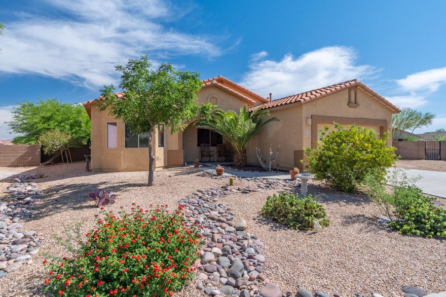 Welcome home! Great price, great location, beautiful mountain views, wonderful floor-plan!! Large open kitchen with amazing granite counter-tops and beautifully finished cabinets'  You will feel right at home with the warm tones inside and tile throughout the main living areas of the home. Both guest and master bathrooms have beautiful granite and refinished cabinets as well.  The low maintenance manicured yards – both front and large back! This home offers SOLAR to keep those monthly electricity bills low, and also has the luxury of natural gas for those who like natural gas for cooking! Home is located just minutes from entertainment of the Casino Del Sol, and Old Tucson, Tons of outdoor adventures awaits. This Beautiful home is ready for its next loving family to open the door. Note: Den could be converted to 4th bedroom..

Upgrades
New granite tops in kitchen and both baths also new sinks and faucets. Repaired drywall cracks and repainted entire house except bed 2 and utility room. Insulated garage door. Landscape back yard and all paver-work. New living room ceiling fan and bath fan. New microwave. Sealed both patios. Barn board on family room wall. New bath mirrors. New control box and valve for drip system. Stained island and both baths vanities.