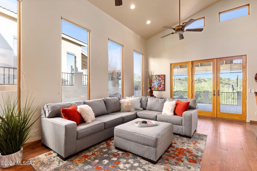 Simplicity and luxury combined! Charming, elegant and beautifully furnished upgraded Villa Milano townhouse in Guard-gated Sin Vacas with Catalina, desert and city light views. High ceilings, spacious layout, great room design, scores of windows, multiple patios, and main floor primary suite make this 4BR, 4BA plus Den/Office 2,740 SF townhouse absolutely the perfect seasonal retreat or year round residence. From the open foyer with beautiful open staircase leading to 3 guest rooms with private baths and front and rear balconies to the open main level den, great room and private primary suite, you'll be totally charmed by this gorgeous, inviting townhome. Easy living with community pool area! Bring your suitcase and come to relax while enjoying the Arizona lifestyle and gorgeous sunsets!