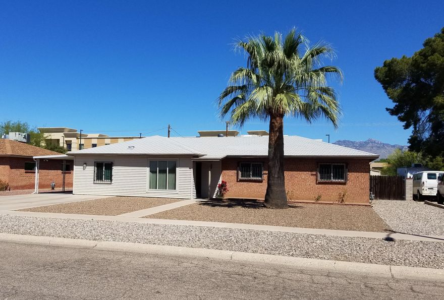**BRAND NEW ROOF TO BE INSTALLED AND COMPLETED BY CLOSE OF ESCROW WITH ACCEPTED OFFER!** Must see this...Brick home that is move in ready. This well cared for 4 bedroom 2 bath home is  near schools, entertainment, public transport, shopping and more! Near Palo Verde park which has a POOL, dog park, and lots of recreation space! This lovely home has updated dual pane windows. The 4th bedroom is located on the opposite side of the home so it makes a great office/playroom/music room or a 4th bedroom! The Kitchen had a complete remodel a few years ago. The dishwasher is brand new the rest of the appliances are newer. Enjoy your morning coffee at the breakfast bar. The home has a great North/South facing orientation. Your covered back yard patio faces the Catalina Mtns., and gets lots of shade The large backyard has two large workshops/storage sheds for all the tools or hobbies. The backyard also has a swing set/play house ready to be used. Come see all that this lovely family home has to offer.