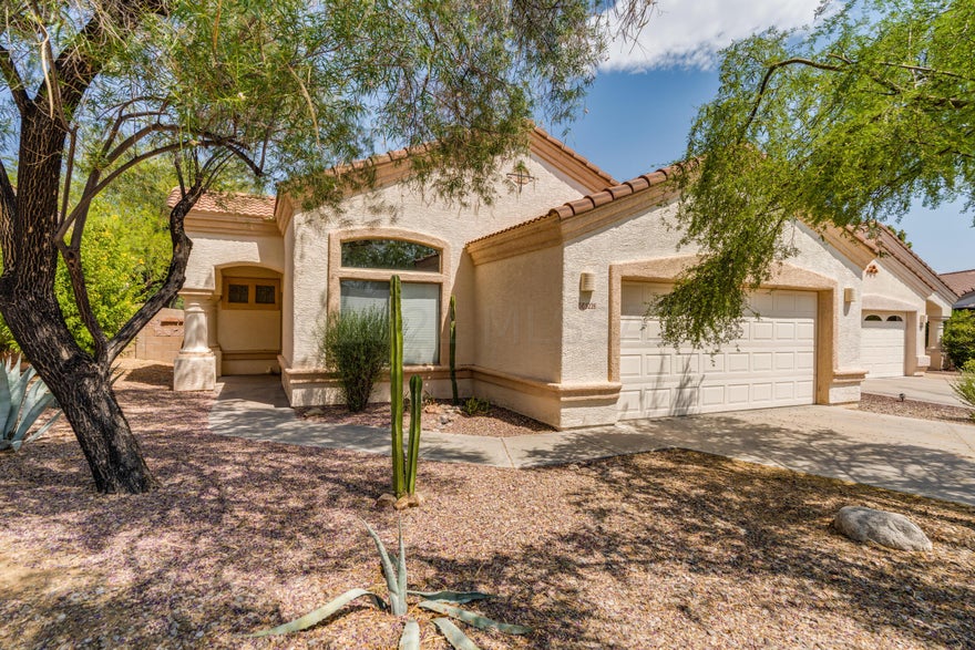 Located in the exclusive Sabino Springs gated community & a stone's throw away from AZ National Golf course, this quality built Richmond American home is a fantastic find. This home truly captures the essence of an open concept layout & features a split bedroom plan. High ceilings, tons of natural light & pride of ownership shines throughout. The kitchen is well appointed with granite counters, large island, room for plenty of cooks in the kitchen, substantial   pantry & a breakfast nook area. The kitchen opens up to the family room making this home delightful to entertain. The master suite is spacious & has a generous bath with a double sink vanity, soaking tub, walk in shower & a walk in closet. Come & fall in love. The backyard features easy care native plants & ultimate privacy backing to natural, lush desert and a hot tub. Hurry, come see this beauty today before someone else beats you to the punch.