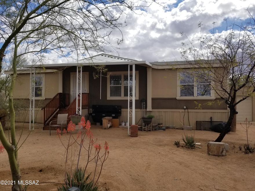 SUNRISE, SUNSET, & MOUNTAIN VIEWS!! This breath taking 3 bedroom 2 bath 1.5 car garage home rests in a private saguaro studded acre lot nestled in the sought-after Picture Rocks Community! The home boasts with it's Gourmet kitchen and open concept floor plan. Excellent for entertaining! Picturesque windows, new carpet, reinforced steal frame covered viewing deck, and new central Air conditioning.  Bring your RV's with dual full RV hookups you can invite your family anytime to visit in comfort.
High-end appliances including Monogram Fridge and no  polybutylene replaced with  pex plumbing, all plants on property is on timed irrigation. Reinforced Steal frame garage or workshop. Better hurry this one won't last long!