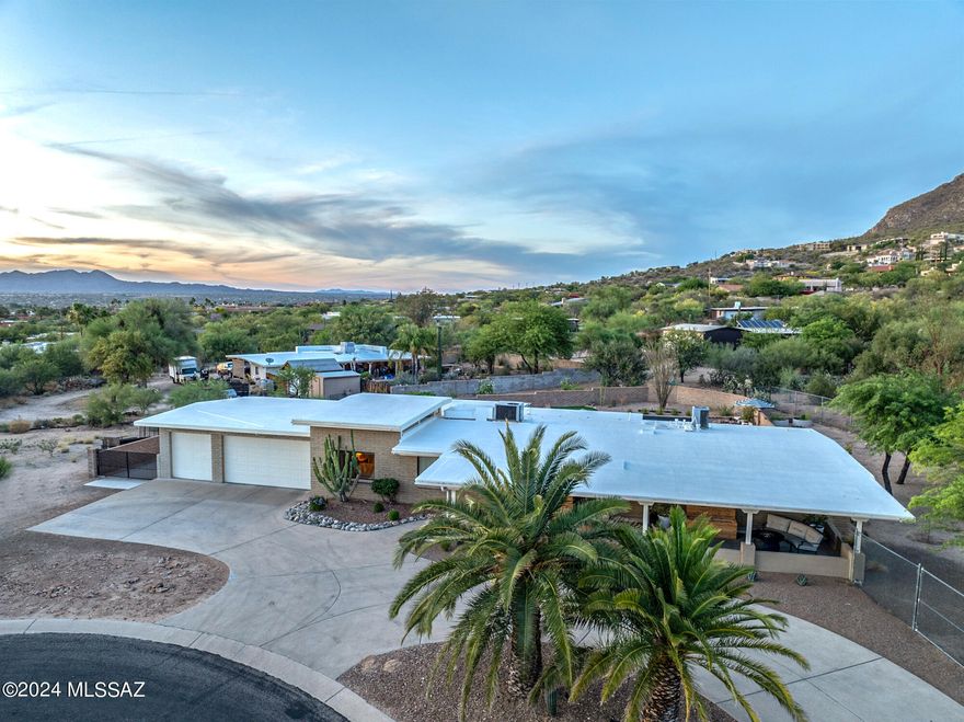 Looking for a single story home on Tucson's Northwest side? No HOA?  Culdesac lot? Mountain views & ...wait for it... an oversize 3 car garage? Check, Check, Check & Check. This beautiful home in Catalina Shadows was meticulously updated by owners who never expected to leave. From a blank canvas when they purchased to a resort style back yard, these owners spared no expense. Every room in the home has been updated. Tasteful use of neutral colors with the texture of wood in their design, I promise you will move in and have everything your heart desires.  The culdesac yard has natural desert to one side and great gardening space to the other. Plenty of room for a pool and/or a spa! Original Primary bedroom had the closet removed to enlarge the space.  Could easily be returned if buyer want.