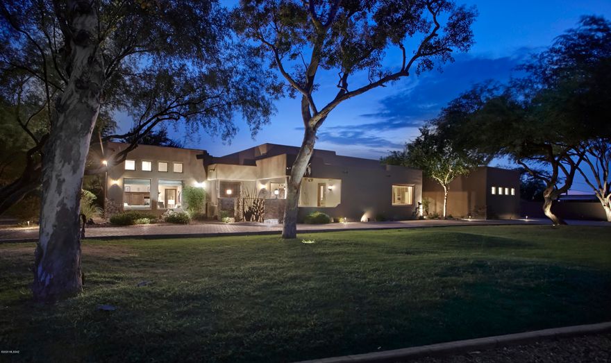 An INCREDIBLE OPPORTUNITY presents itself to own one of the largest parcels in Tucson Country Club Estates ideal for the equestrian buyer or anyone looking to social distance in style! This 5 bedroom/ 6 bath spacious home has been updated to total perfection featuring gourmet kitchen with commercial grade stainless appliances, granite countertops, island with prep sink, double ovens, and an inviting bar perfect for entertaining. Travertine floors throughout, solid alder wood doors and baseboards, walls of windows, and a lavish master suite with fireplace, sitting room, exercise area, custom walk-in closet, and spa like bathroom and a second Master Suite.  The private guest house affords guests a luxurious stay while maintaining the suggested ''6 feet'' distance from main house, but is only steps away from the inviting pool and spa. An incredible resort-like backyard features an outdoor kitchen/bbq area, sports court, fire pit, lush lawn, mature mesquite trees, and expansive covered patio with outdoor tv, and rare for TCC, a spacious 4 car garage with storage. The included 5-acre parcel would be ideal for a horse lover, a kid's dream playground, or a big kid's pole barn for toy storage. Properties like this rarely come on the market in TCC and should not be missed!