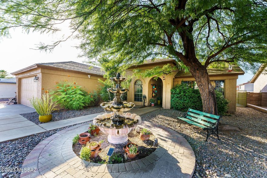 Meticulously maintained and truly loved, this charming home with backyard oasis will not disappoint! This 3 bedroom, 2 bathroom home features a newer roof, recently painted interior and exterior, brand new kitchen appliances, newly refinished Saltillo tile, custom lighting throughout, wood burning fireplace, vaulted ceilings, and a light and bright floorplan. The front yard is welcoming with a large working fountain and expertly landscaped yard. The backyard oasis boasts a covered patio with 2 TVs that stay, gazebo with working spa, firepit and pavers, not to mention the lush green plants and trees to include orange, pomegranate, and apple! No Poly Pipes!
