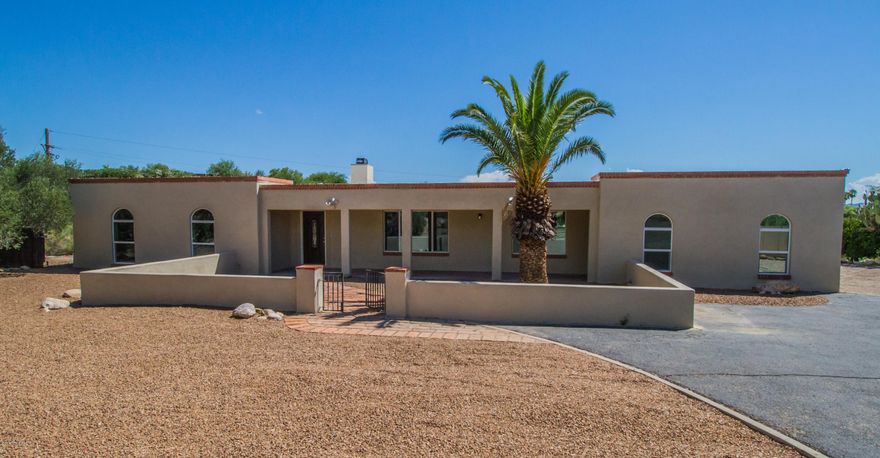 Stunning move-in ready home on over an acre with an abundance of upgrades! Neutral interior palette, beautiful wood ''look'' tile throughout, spacious and open floorplan, plus lots of natural light! Gourmet kitchen boasts custom cabinetry, granite countertops, stainless steel appliances, and more! Huge great room at the front of the home, plus family room with built-in shelving! All bedrooms boast new carpeting. Relax and unwind in the huge master suite with private patio access. All three bathrooms feature stylish tile surround showers, granite counters, and upgraded fixtures. Soak up the Arizona sunshine and mountain views in the ultimate backyard oasis, complete with sparkling pool! The perfect home for entertaining, inside and out