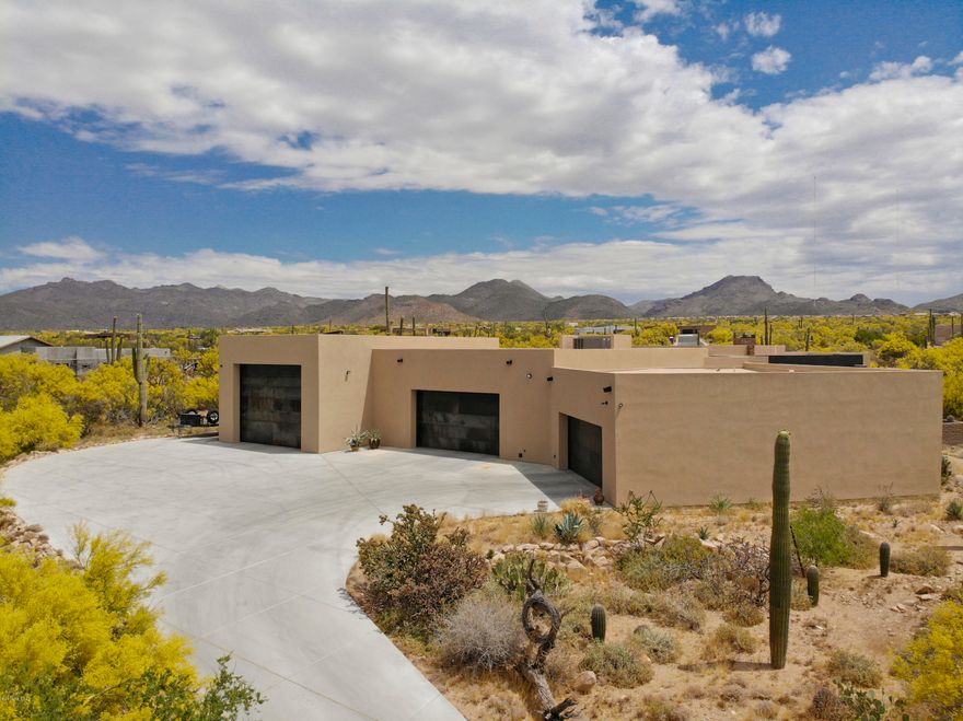 This phenomenal luxury home is an enticing blend of contemporary & rustic styling combined w/unparalleled craftsmanship from 4th generation builder John Herder. Situated within the gated community of The Estates at Tortolita Preserve on a spacious & private 2.5 acre lot. Choose this completed home or pick your own finishes on an under construction spec home at Lot 9! An enormous 4,500 square foot heated/cooled garage offers the car/outdoor lover a dream garage complete with covered RV storage, workshop space, compressed air lines, additional laundry area & so much more! Quartz kitchen countertops, a DaVinci fireplace, beamed ceiling treatments, decorative metal I-beam, & highly finished cabinetry are just some of the many finish level upgrades that need to be seen to be fully appreciated.