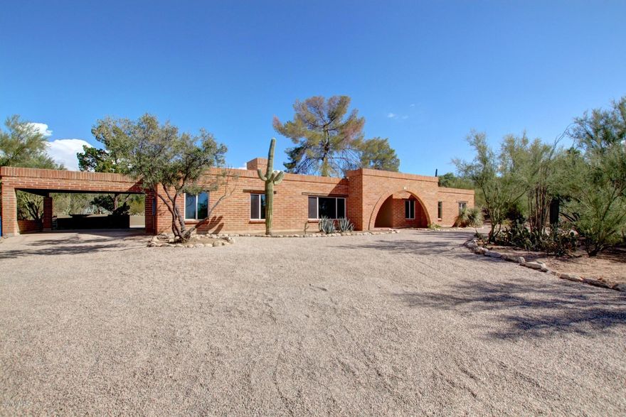 Stunning 4 bedroom 2.5 bath Home with Spectacular Catalina Mountain views. Recently upgraded home with a spacious and open floorplan with abundance of natural light throughout. Beautiful wood plank tile, custom lighting and wall paint throughout. The Gourmet Kitchen sets this kitchen apart. Custom cabinetry, granite and butcher block countertops, stainless steel appliances and spacious custom Island. Huge great room off pool, plus Living room room with Stone faced fireplace. Relax and unwind in the huge master suite with gorgeous master bathroom with custom cabinetry and granite counters and walk in closet w/custom shelving and private backyard access to mountain views. Bathrooms feature upgraded fixtures and stylish tile surround at showers. The perfect home for entertaining.
