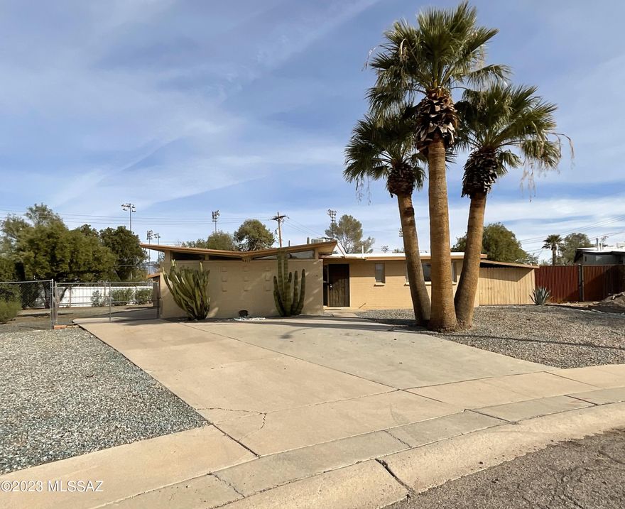 Here is a great remodel opportunity with a three bedroom two bath home with garage located on a huge .34 acre lot. Walk out the back gate and into the City's Palo Verde Park. Walk to the end of the block and you are at the Arizona A Rated Kellond Elementary School. Close access to dining, shopping, transportation and more. No HOA. New water main and gas lines along with sewer line clean outs. Central AC. Refrigerator, gas range, microwave and dishwasher included. Washer/dryer connections in the home not outside. Ceiling fans. Split bedroom floor plan. All tile flooring. Property being sold ''AS IS''.