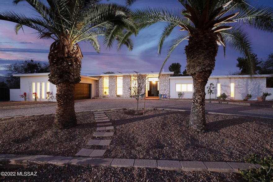 Fall in love with this stunning contemporary resort style home located in 24 hour Guard Gated Tucson Country Club Estates!  This 5Bed/3Bath gem is an entertainer's dream and boasts a tennis court, sparkling pool with lounge area, ramada, built-in gas fire pit and outdoor kitchen.  Lounge by the pool and enjoy incredible unobstructed views of the Catalina Mountains within a private backyard with no neighbors on either side. Gourmet kitchen adjoins great room and includes granite counter tops, oversized professional fridge, 6 burner gas range, and double ovens.  Once you visit this home you will never want to leave.  House has owned solar panels, new flooring throughout entire home, and is newly painted inside and out.  Every inch has been updated and immaculately maintained.