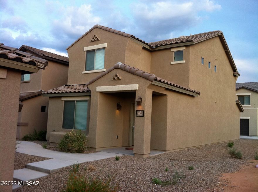 Wonderful 2br/2.5ba home near Davis-Monthan Air Force Base! downstairs all tile with powder room. Kitchen features a breakfast bar with all appliances included, upstairs boasts 2 spacious bedrooms, washer and dryer included. A/C, 2 car attached garage, Access to Community Pool!