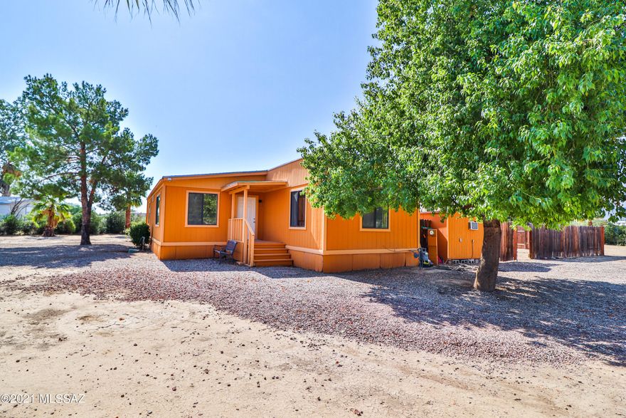 Gorgeous upgraded immaculately clean fenced in horse property. Oleanders planted around fence line of property to make it very private. Located on NW side of town by Cortaro and I-10 with all the chain restaurants and shopping across the highway. Beautiful Mountain View's all around. This 2 bed 2 bath double manufactured home has been modernized in all the right places! Kitchen features granite countertops as well as in both bathrooms. Stainless steel appliances and real wood cabinets with a lazy susan, Also new deluxe vinyl wood flooring, new water re-pipe with Apex. The home sits on a spacious huge lot 1.16 acres with lots of beautiful palm trees. Also RV hook up! Come view it today!!!