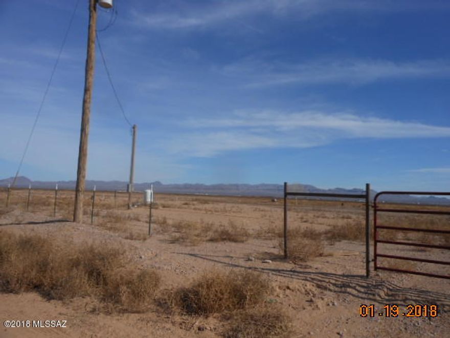 40 FULLY FENCED ACRES WITH 7 STRANDS BARBED WIRE. PISTACHIO ORCHARD ACROSS ROAD . PROPERTY HAS IRRIGATION WELL.