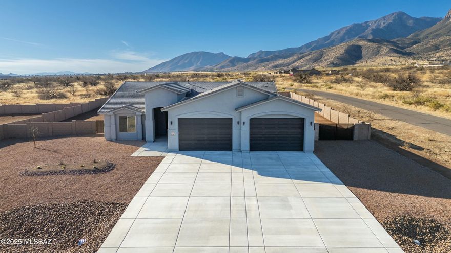 Custom New Home by Sun Canyon Homes,Inc. 4 car garage with 10ft garage doors and 4ft garage expansion. Perfect for large trucks or camper vans, includes epoxy garage floor finish, expanded patio area, 4 bedrooms, 3 bathrooms, Jacuzzi tub and shower, sitting area in bedroom, wood look tile throughout, granite counter tops with cook top and double ovens. Landscaping in front yard. The exterior is full stucco finish, extending to the eaves and fascia. This home boasts an array of energy-saving features, including 2x6 exterior framing with full shear, Dual Glazed Low-E Glass Windows,R-38 Fiberglass in Ceilings, Open-cell foam exterior wall insulation, Tyvek wrap vapor barrier. The Ranchos San Pedro subdivision has breathtaking mountain views all around. Stop by and see this beautiful home.