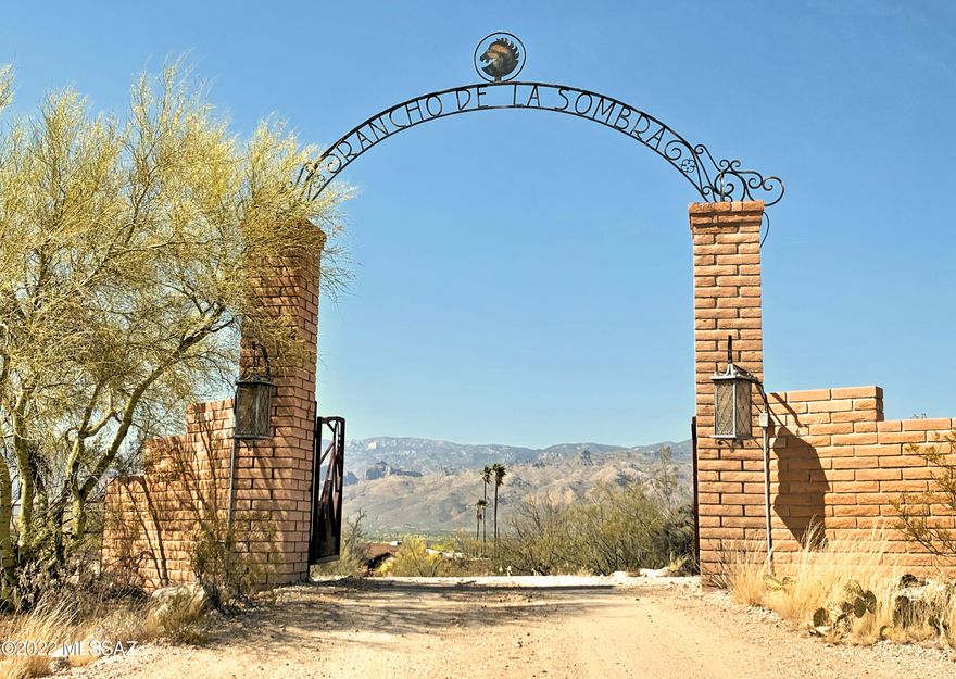 Rancho De La Sombra. 28.162 ACRES per survey! Rare opportunity to own an entire corner at Broadway/Tanque Verde Loop! Mid-Century Modern, Burnt Adobe Ranch. Family ownership for over 50 years. Once a grand equestrian estate, now ready for the vision of new ownership. Lodge Style Architecture - heavy beams, wall of windows- perched atop a gentle hill. VAST MOUNTAIN VIEWS! Banquet room for huge gatherings opens to a family/media rm. Granite slab, custom kitchen w/island & Sub Zero fridge. Original hand wrought hardware & solid doors are blended w/modern elements incl: Travertine & Rojo style concrete flooring, recent baths, Pella windows. The land is gently rolling, highly useful & sports stunning views from all corners! City water plus 2 capped water wells. This estate is offered as-is.