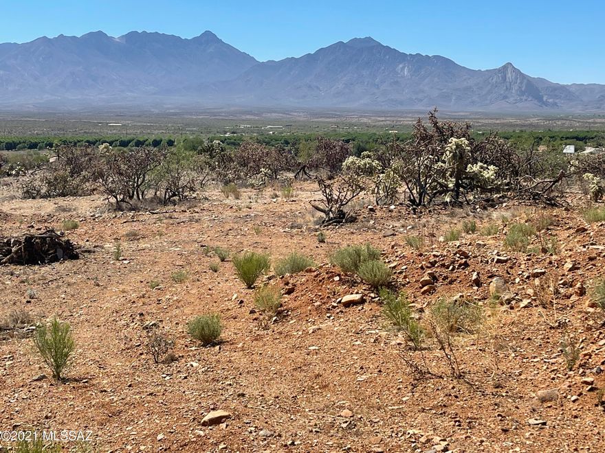 ONE-OF-A-KIND property can be yours! Overlooking the entire Santa Rita Mountain Range and the valley below, this lot provides 360-degree view, all the way from the Catalinas to Nogales.  This elevated lot of 2.84 acres already has a flat building site with plenty of room for your dream home. Driveway access is already in and sale includes plans for additional driveway options. Once in a life time opportunity for a prime piece of property.  ZONED RURAL HOMESTEAD giving you many building options. ~ Surveys, utility connection option plans, perc test, estimates for various items, etc. are available and can be provided to SERIOUS potential buyers at no charge. ~~  PRICE IS FIRM !!!